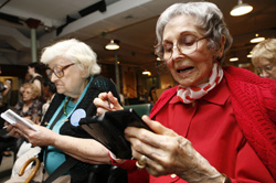 In this photo provided by Nintendo, Ethel Bockman, 94, right, and Stella Zielecki, 88, both of Manhattan, play Brain Age 2 on Nintendo DS, Friday, Sept. 28, 2007, at The Carter Burden Center for the Aging in New York. Nintendo visited the center to show off video games that appeal to adults. (Nintendo Photo by Diane Bondareff)