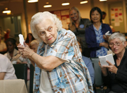 In this photo provided by Nintendo, Lillian Faybik, 87, of Manhattan, plays baseball on the Wii from Nintendo, Friday, Sept. 28, 2007, at The Carter Burden Center for the Aging in New York. Nintendo visited the center to show off video games that appeal to adults. (Nintendo Photo by Diane Bondareff)